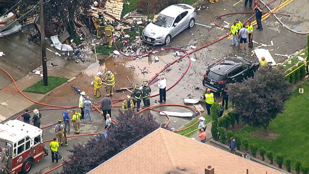 PHOTO: An explosion brought down a Ridgefield, New Jersey house Monday, covering the road, backyard and littering surrounding property with debris.
