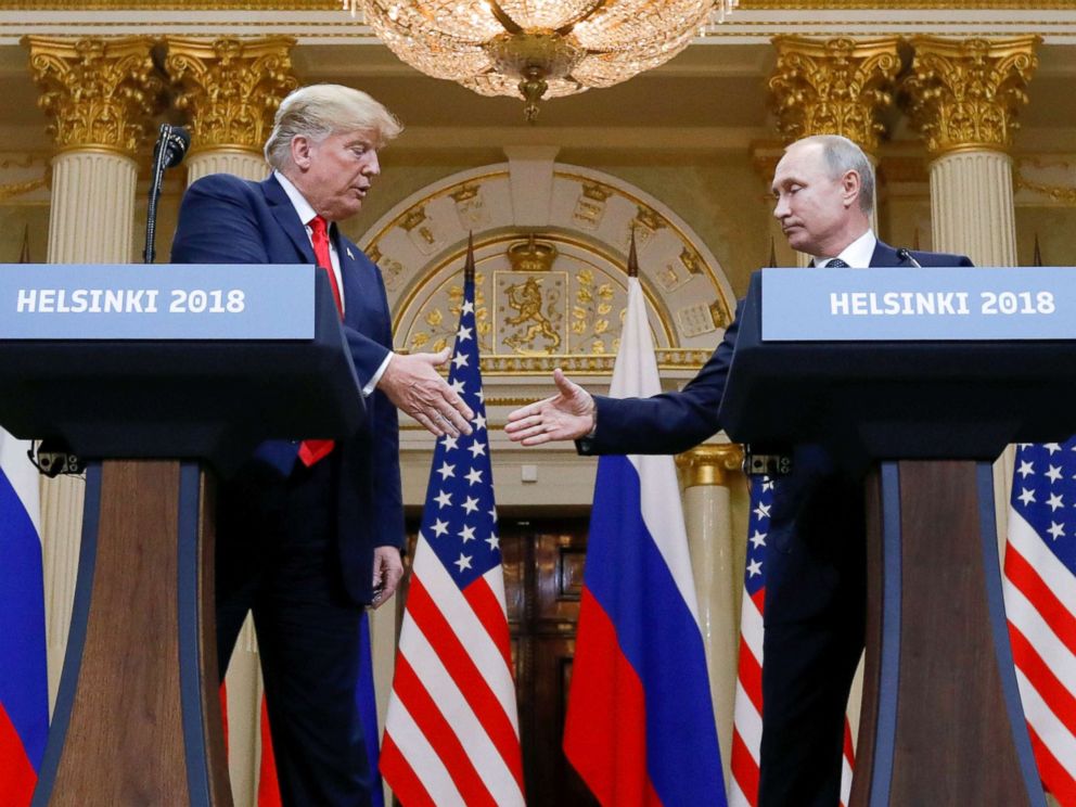 PHOTO: President Donald Trump and Russias President Vladimir Putin shake hands during a joint news conference after their meeting in Helsinki, Finland, July 16, 2018.