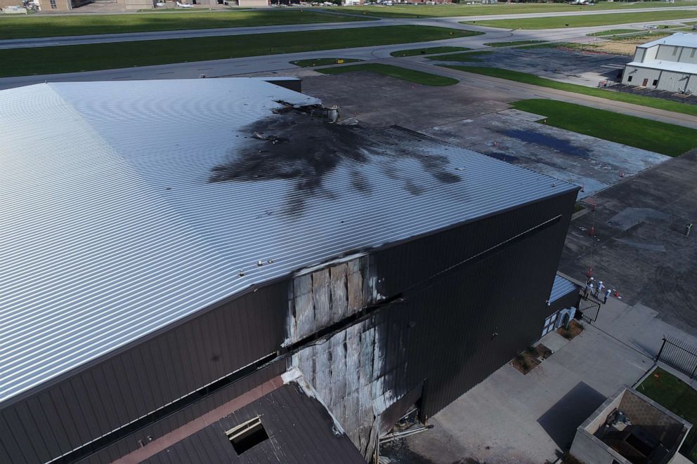 PHOTO: The charred damage to an airport hangar is seen after a twin-engine plane crashed, killing 10, on June 30, 2019, outside Dallas, Texas.