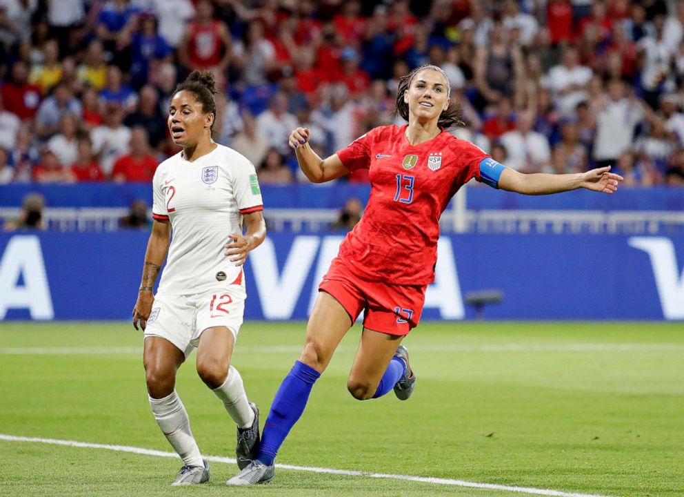 PHOTO: US Alex Morgan, right, celebrates after scoring her second goal next to Englands Demi Stokes during the Womens World Cup semifinal soccer match between England and the United States at the Stade de Lyon in Lyon, France, July 2, 2019.