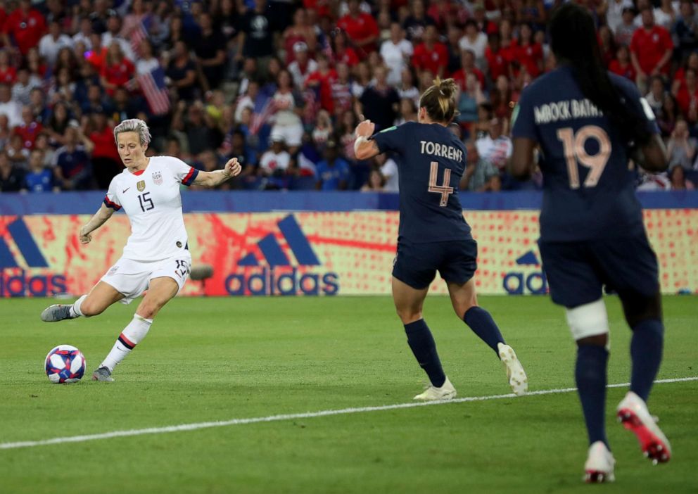 PHOTO: United States Megan Rapinoe, right, on her way to scoring her sides second goal during the Womens World Cup quarterfinal soccer match between France and the United States at the Parc des Princes, in Paris, June 28, 2019.