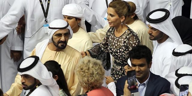 Sheikh Mohammed bin Rashid al-Maktoum (L), Vice-President and Prime Minister of the UAE and Ruler of Dubai, arrives with his wife Princess Haya bint al-Hussein (C), to the trophy presentation in the Meydan Racecourse on March 31, 2018 in Dubai. KARIM SAHIB/AFP/Getty Images