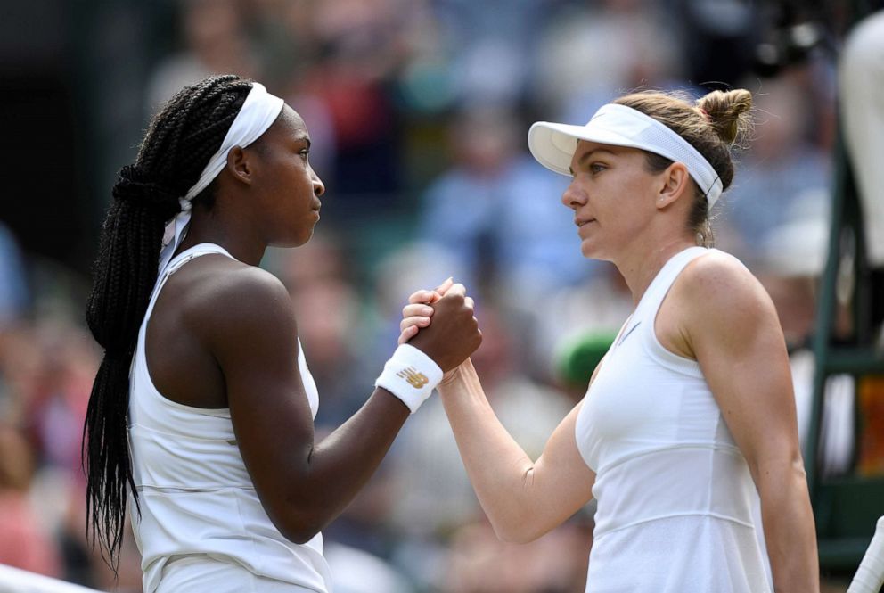 PHOTO: Cori Gauff of the U.S. congratulates Romanias Simona Halep, right, after their fourth round match at Wimbledon, July 8, 2019, in London.