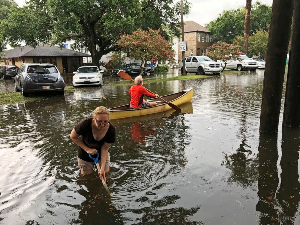 PHOTO: People cope with the aftermath of severe weather in the Broadmoor neighborhood in New Orleans, Wednesday, July 10, 2019.