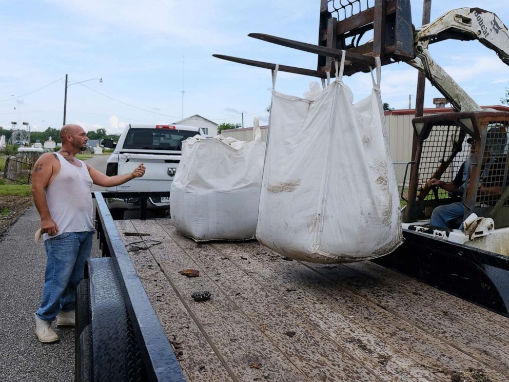 PHOTO: Kerry Warren works to get sand bags ready for flood prevention ahead of a tropical system in Lafitte, La., July 11, 2019.