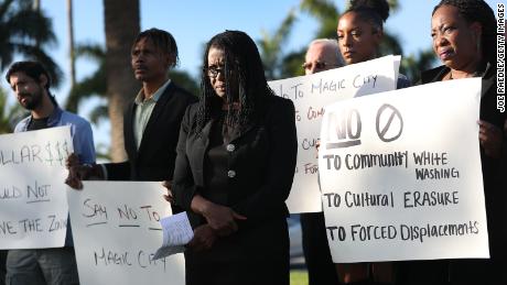 Marleine Bastien, center, protests with residents and activists against the Magic City plans.  