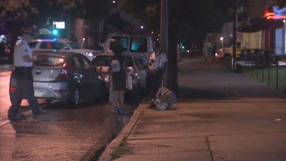 PHOTO: Police officers are shown with the car that had been stolen while children were inside on July 11, 2019 in Philadelphia.