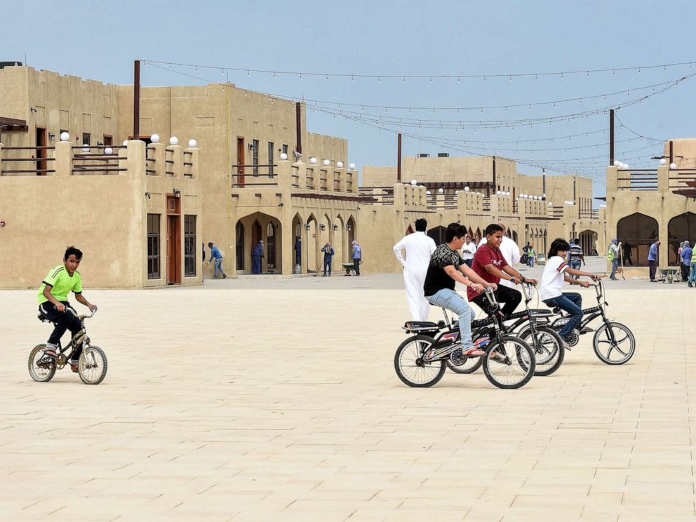 PHOTO: In this file photo, children ride their bicycles at the reconstructed historical quarter of Awamiya, a Shiite-majority town on Saudi Arabias oil-rich eastern coast on April 28, 2019.