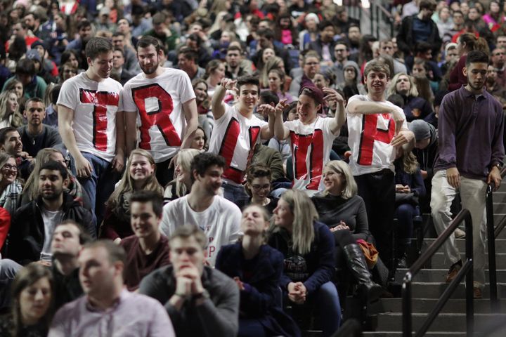 Liberty University students wear homemade T-shirts spelling "TRUMP" while waiting for the arrival of then-candidate Donald Tr