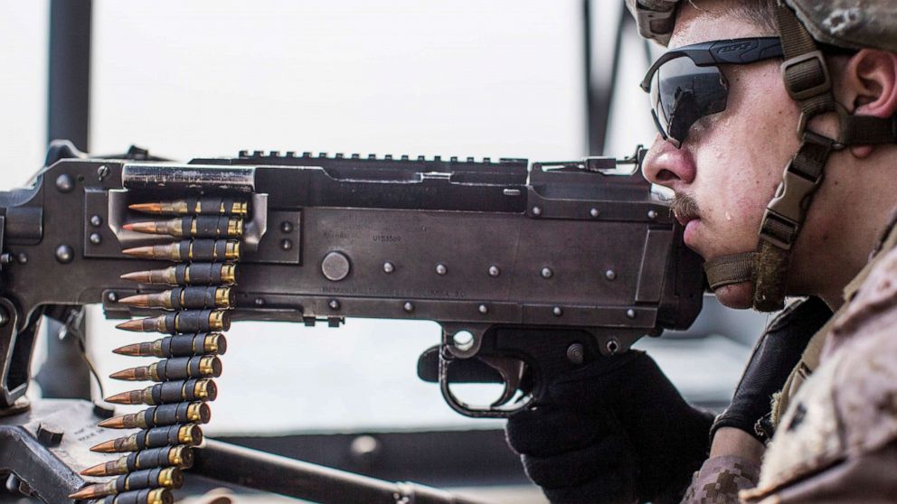 PHOTO: U.S. Marine Corps Lance Cpl. Adrian Hannabradley provides security with an M240B machine gun during a strait transit aboard the amphibious assault ship USS Boxer, July 18, 2019.