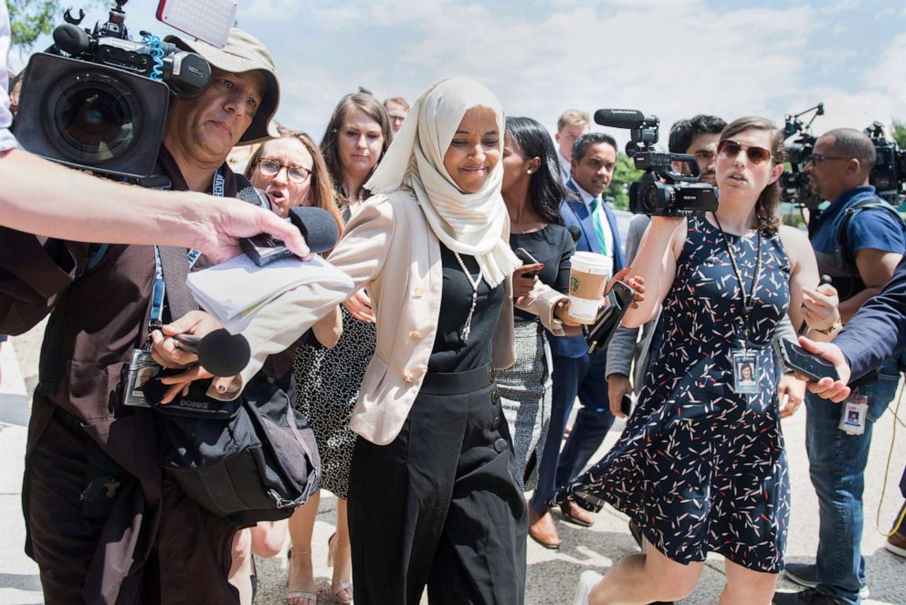 PHOTO: Rep. Ilhan Omar responds to reporters questions after a vote in the Capitol, about derogatory comments made by President Trump about her and other freshmen members, July 18, 2019.