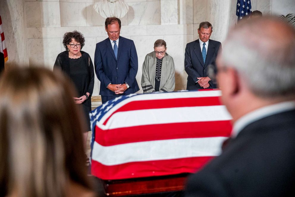 PHOTO: A moment of silence during a private ceremony in the Great Hall of the Supreme Court in Washington, July 22, 2019, where the late Supreme Court Justice John Paul Stevens lies in repose.