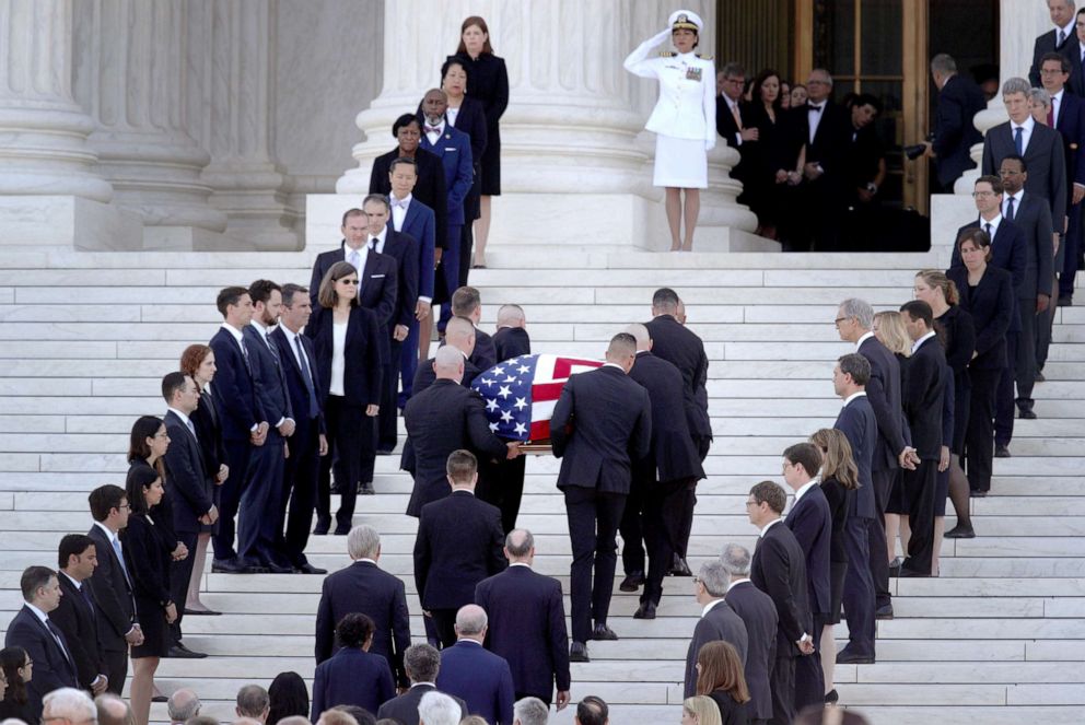 PHOTO: Members of the U.S. Supreme Court police serving as pallbearers carry the casket of the late Associate Justice John Paul Stevens through a cordon of former law clerks and up the steps of the U.S. Supreme Court, July 22, 2019, in Washington, DC.