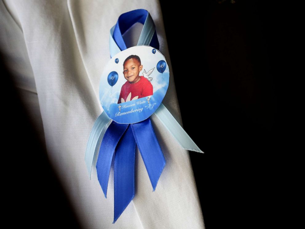 PHOTO: In this Tuesday, Aug. 14, 2018 photo taken in Houston, a pin on the lapel of Dikeisha Whitlock-Pryers jacket shows a photo of her son, Raymond Pryer Jr.