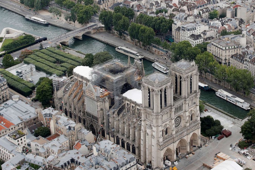 PHOTO: A view shows the damaged roof of Notre-Dame de Paris during restoration work, three months after a fire that devastated the cathedral in Paris, July 14, 2019.