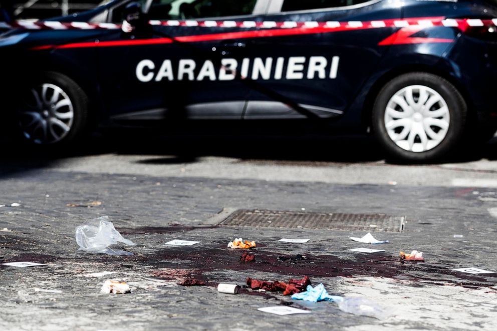 PHOTO: A car of the Italian Carabinieri, paramilitary police, is parked near a blood stain, the site where Carabiniere Vice Brigadier Mario Cerciello Rega was stabbed to death by a thief in Rome, Friday, July 26, 2019.