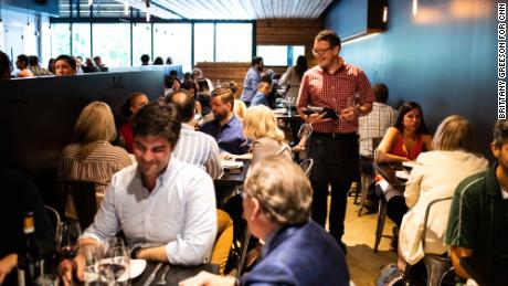 People dine at Selden Standard, an upscale restaurant in Midtown, also known by natives as Cass Corridor. The building was once an abandoned laundromat.