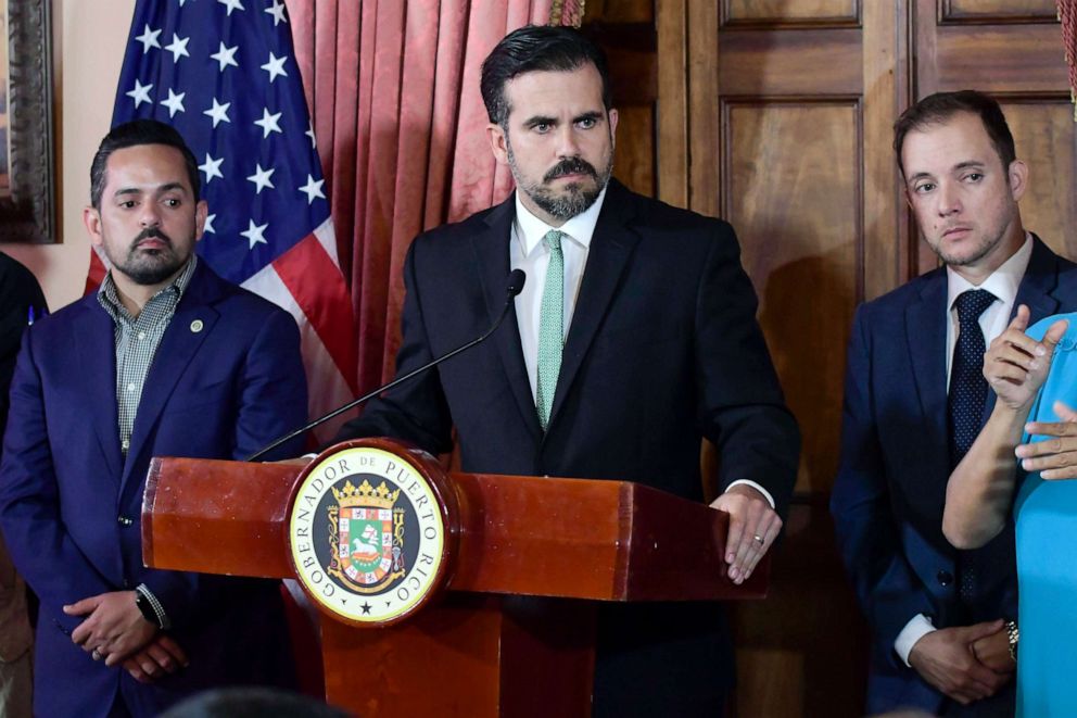 PHOTO: Puerto Rico Gov. Ricardo Rossello, accompanied by his chief of staff Ricardo Llerandi, right, attends a press conference in La Fortalezas Tea Room, in San Juan, Puerto Rico.