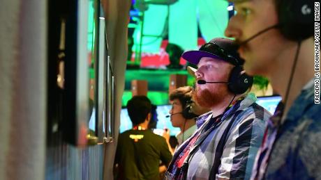 Gamers play &quot;Fortnite&quot; on PS4 consoles at E3 2018 in Los Angeles, California.