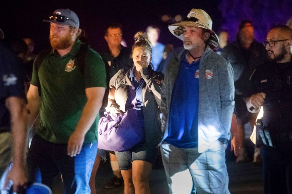 PHOTO: Police officers escort people from Christmas Hill Park following a deadly shooting during the Gilroy Garlic Festival, in Gilroy, Calif., July 28, 2019