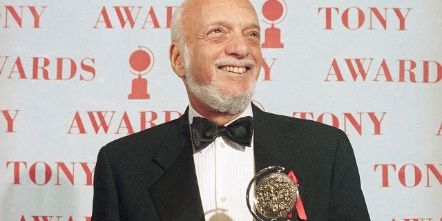 In this June 4, 1995 file photo, Harold Prince holds his Tony award for best director in a musical for "Show Boat," at Broadway's Minskoff Theater in New York. Prince, who pushed the boundaries of musical theater with such groundbreaking shows as “The Phantom of the Oepra,” "Cabaret," "Company" and "Sweeney Todd" and won a staggering 21 Tony Awards, died Wednesday, July 31, 2019, after a brief illness in Reykjavik, Iceland. He was 91.