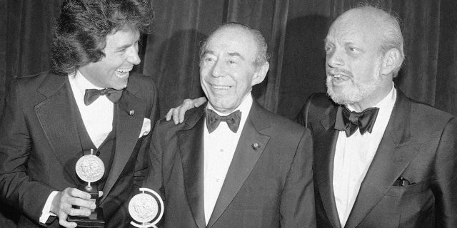 In this June 4, 1979 file photo, Jack Hofsiss, left, and Hal Prince, right, flank Richard Rodgers at the Tony Award presentations in New York. Prince, who pushed the boundaries of musical theater with such groundbreaking shows as “The Phantom of the Oepra,” "Cabaret," "Company" and "Sweeney Todd" and won a staggering 21 Tony Awards, died Wednesday, July 31, 2019, after a brief illness in Reykjavik, Iceland. He was 91.