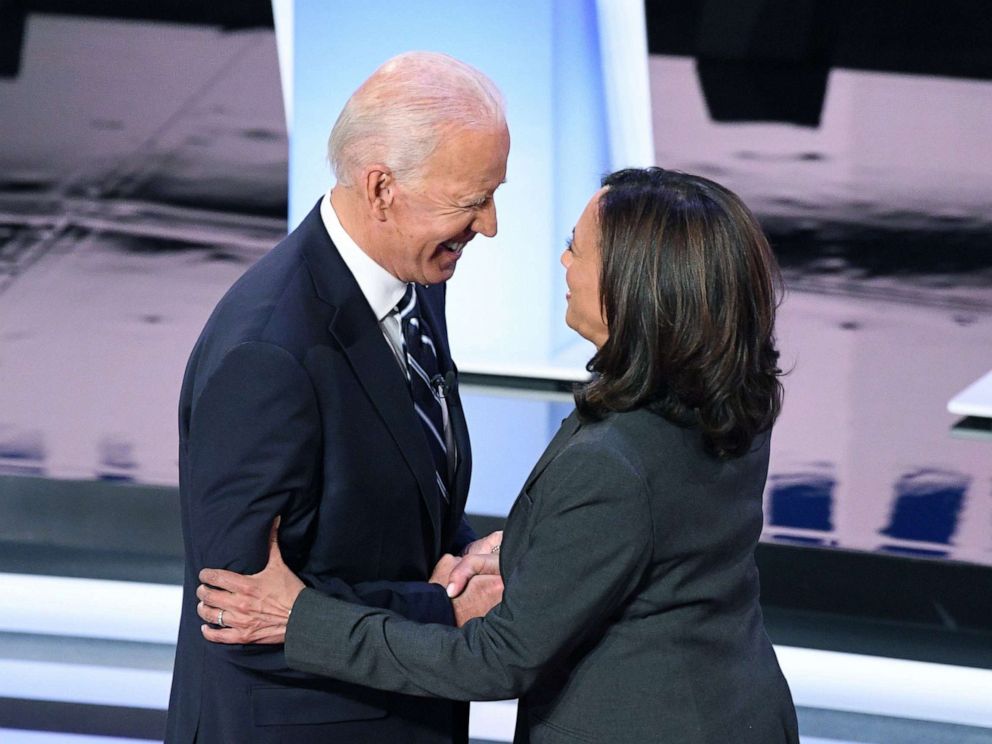 PHOTO: Democratic presidential hopefuls former Vice President Joe Biden and Sen. Kamala Harris greet each other ahead of the second round of the second Democratic primary debate in Detroit, July 31, 2019. 