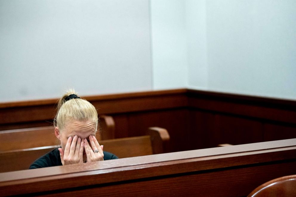 PHOTO: Amiee Cagle, fiancee of 32-year-old Kenneth A. White, wipes her eyes as overcome with emotion as attorneys deliver closing arguments during a juvenile sentencing hearing on June 19, 2019, at Genesee Circuit Court in Flint, Mich.