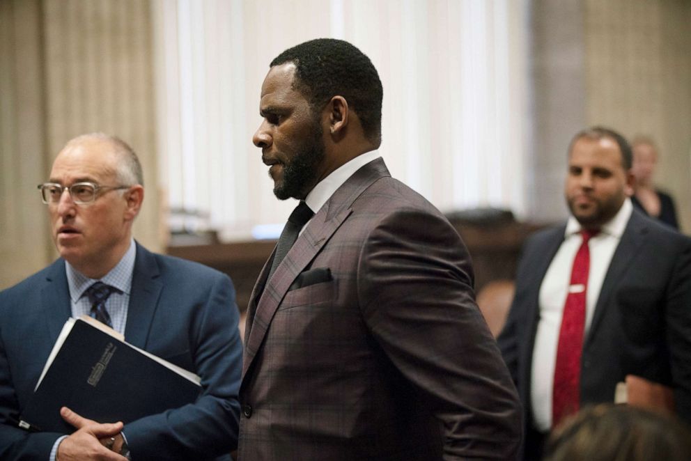 PHOTO: R&B singer R. Kelly (C) appears at a hearing before Judge Lawrence Flood at Leighton Criminal Court Building June 26, 2019 in Chicago, Illinois.