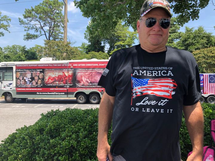 Mark Dawson, who thinks Muslims should be removed from the U.S., poses for a photo outside the Williams Arena in Greenville. 
