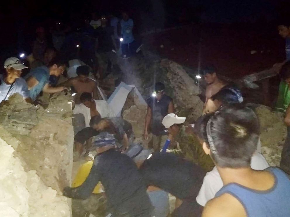 PHOTO: Rescuer teams search for survivors following two earthquakes that struck the northernmost island of Itbayat, Batanes province in northern Philippines, July 27, 2019.