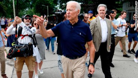 Former vice president and Democratic presidential candidate Joe Biden greets local residents while walking in the Independence Fourth of July parade, Thursday, July 4, 2019, in Independence, Iowa. (AP Photo/Charlie Neibergall)