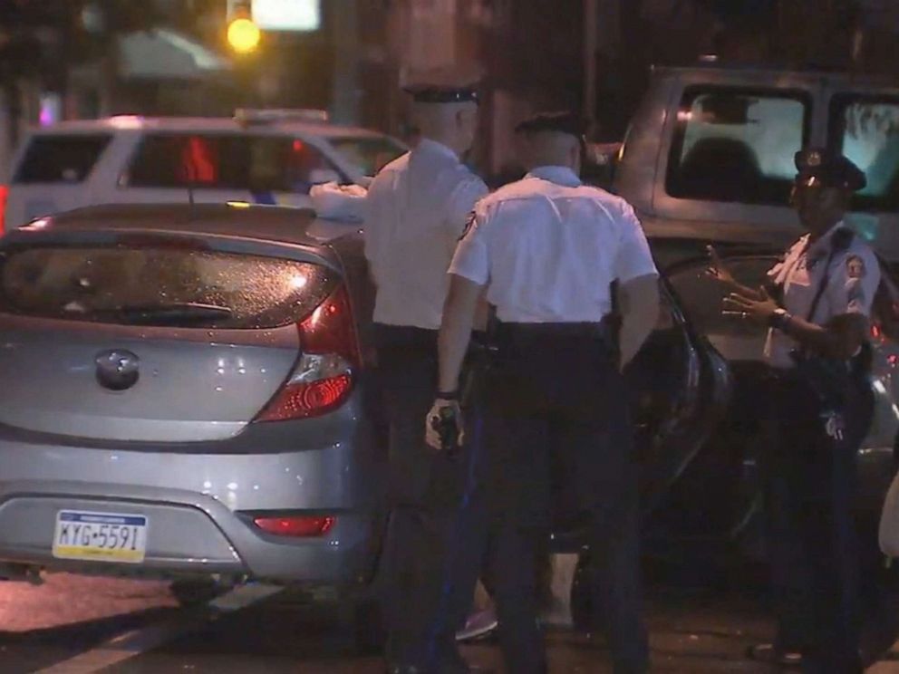 PHOTO: Police officers are shown with the car that had been stolen while children were inside on July 11, 2019 in Philadelphia.