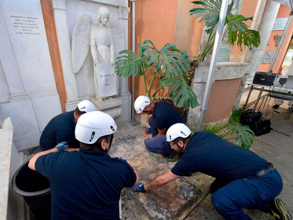 PHOTO: Workers open one of the two tombs within the Vaticans grounds in the Teutonic Cemetery, July 11, 2019, as part of a probe into the case of Emanuela Orlandi, a teenager who disappeared in 1983.