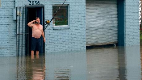 David Fox makes a call on Wednesday, July 10, from his business on Poydras Street in New Orleans.