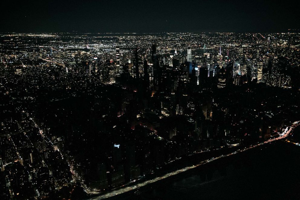 PHOTO: Seen from the air, a large section of Manhattans Upper West Side and Midtown neighborhoods sit coated in darkness during a partial blackout, July 13, 2019 in the Manhattan borough of New York City.