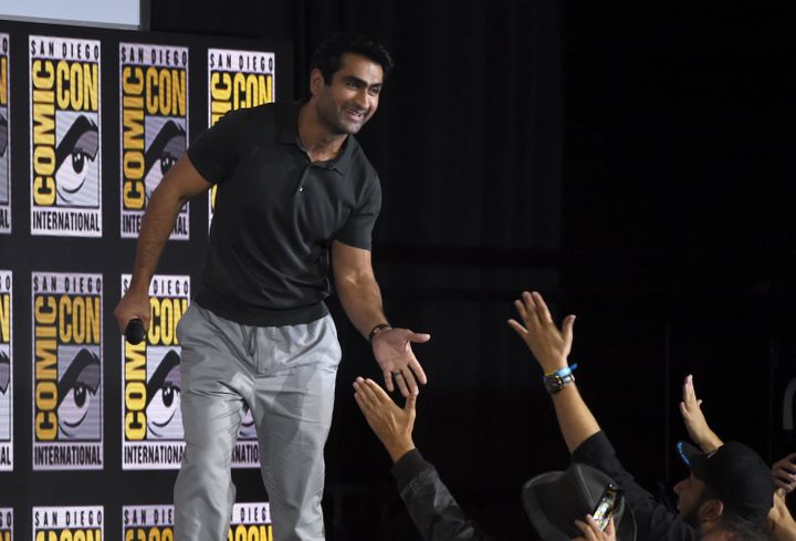 Kumail Nanjiani high-fiving fans on Saturday at San Diego Comic-Con.