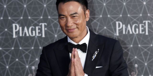 Hong Kong actor Simon Yam poses on the red carpet