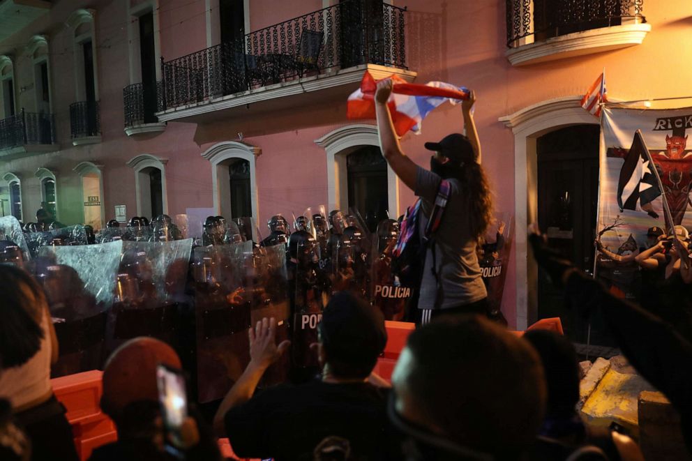 PHOTO: Demonstrators and police face off during a protest against Ricardo Rossello, the governor of Puerto Rico on July 17, 2019, in Old San Juan, Puerto Rico.