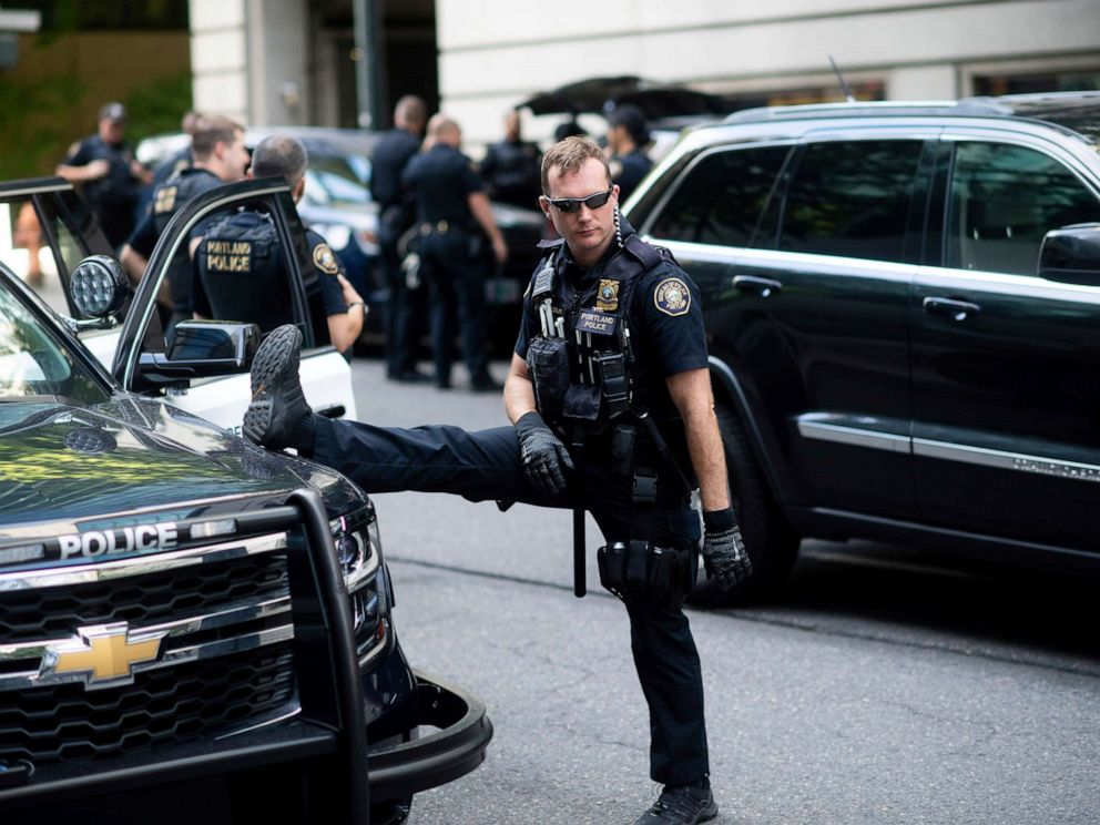 PHOTO: Portland police officer Bonczijk stretches before the start of a protest in Portland, Ore., on Saturday, Aug. 17, 2019.