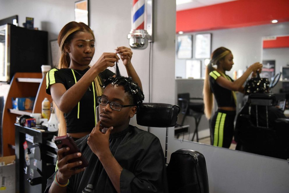 PHOTO: Francina Townes, 18, works as a part-time hairdresser while studying at high school in Baltimore, Maryland, U.S., May 27, 2019.