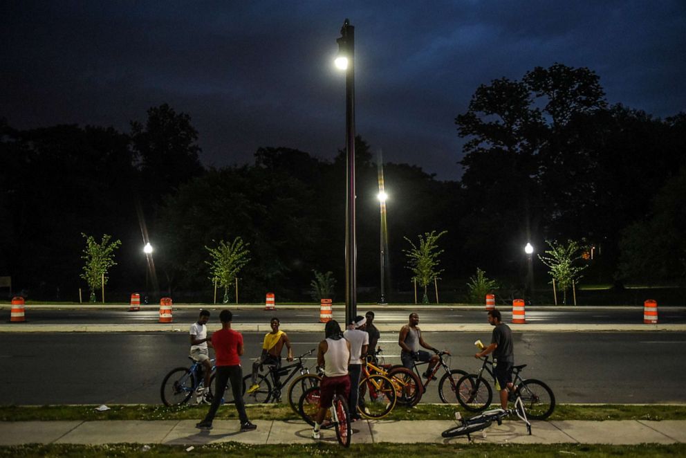 PHOTO: Young people ride their bikes on Reisterstown Rd. outside the parking lot of Hip Hop Chicken in Baltimore, Maryland, U.S., May 26, 2019. Each Sunday the bikers gather to ride their bikes and hang out in a loosely affiliated group of bikers.