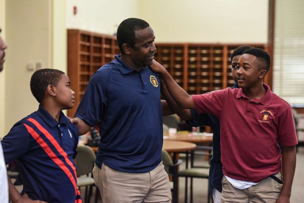PHOTO: Edwin Avent, center, participates with students in a learning exercise at a summer session of a charter school called Baltimore Collegiate School for Boys in Baltimore, Maryland, July 30, 2019.