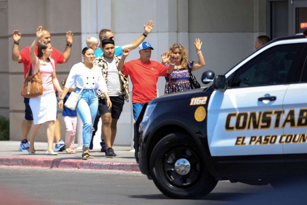 PHOTO: Shoppers exit after a mass shooting at a Walmart in El Paso, Texas, Aug. 3, 2019.