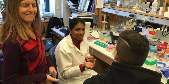 Dr. Jean Bennett, left, was working on a type of gene therapy for Christian's condition when he and his family met her at the Children's Hospital of Philadelphia.