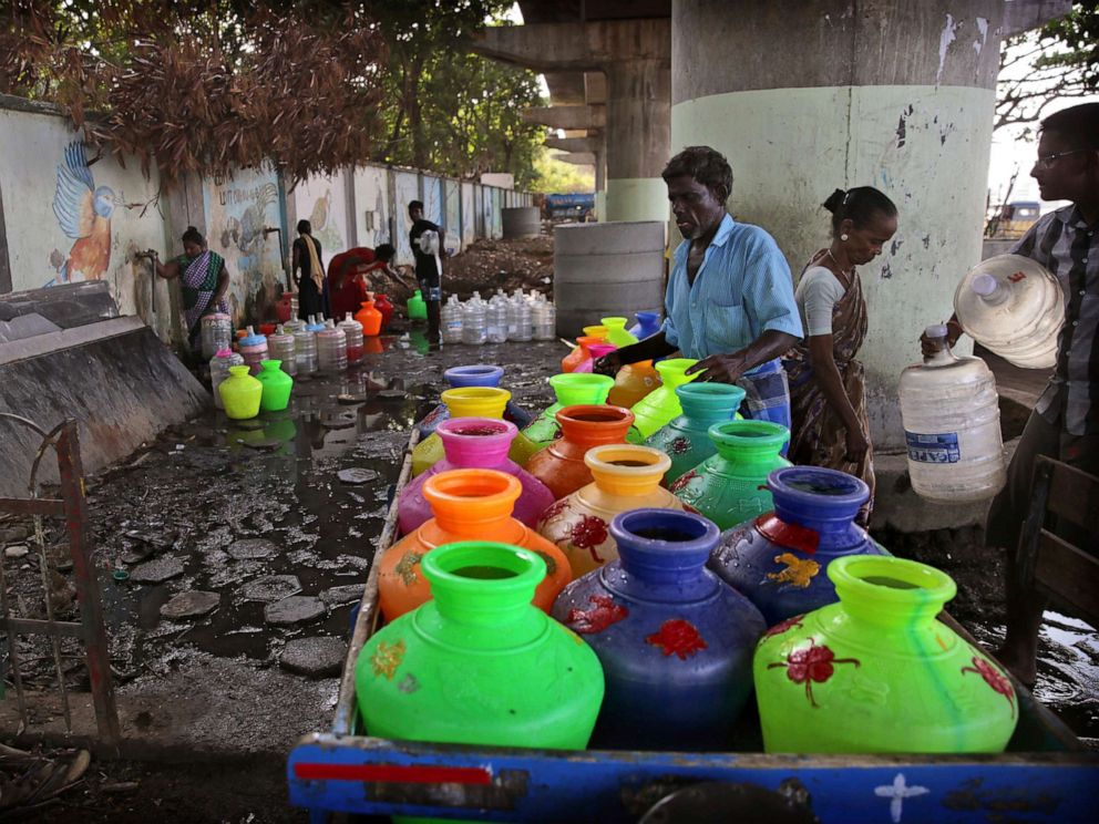 PHOTO: In this Monday, July 15, 2019, photo, Indians fill drinking water at a water filling depot in Chennai, capital of the southern Indian state of Tamil Nadu.
