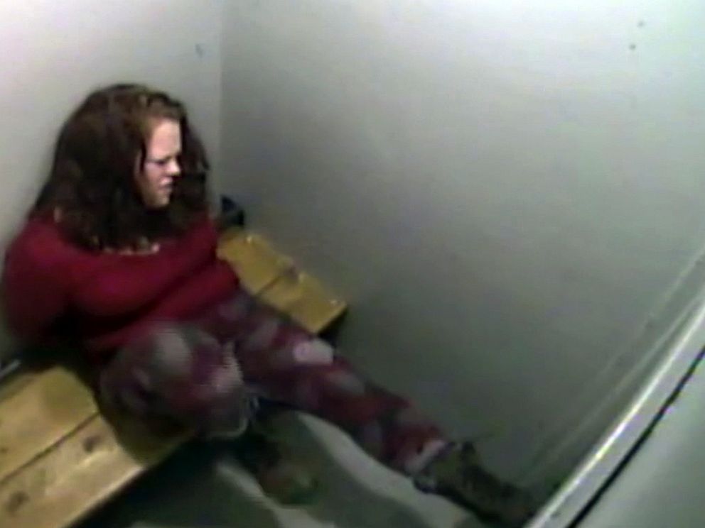 In this March 14, 2019, image from surveillance video released by the St. Albans Police Department, Amy Connelly kicks the door of a holding cell at the police station in St. Albans, Vt. The police chief said he has changed the use-of-force reporting