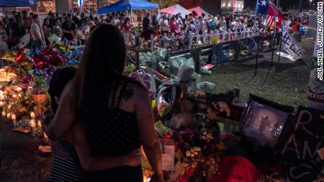 Amber Basurto, 9, left, and her mother, Priscilla Basurto, 39, visit a memorial for the El Paso victims on Thursday.