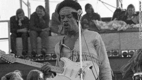 Jimi Hendrix performing his legendary two-hour set at Woodstock.