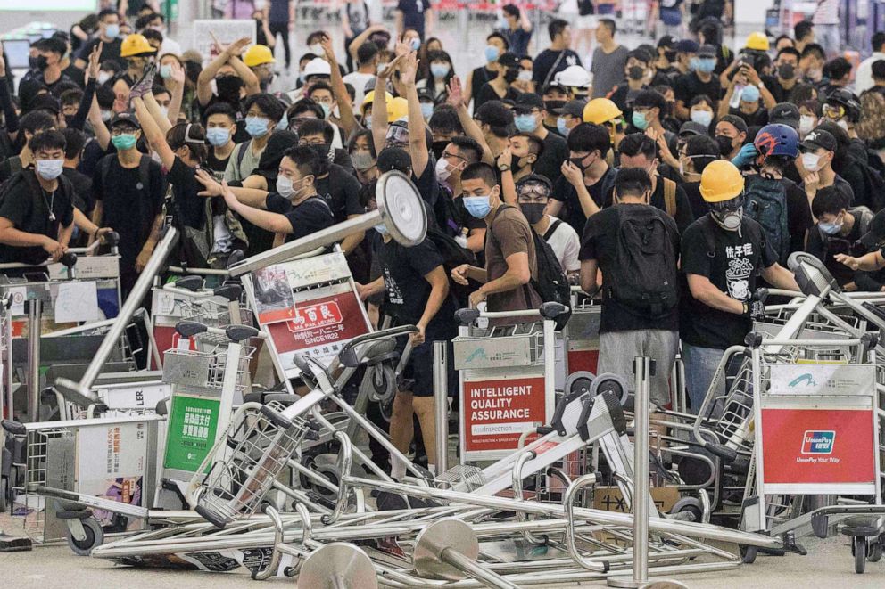 PHOTO: Demonstrators form a barricade as they clash with riot police at Hong Kong International Airport, Aug. 13, 2019.
